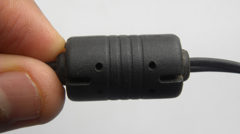 The Mysterious Black Cylinder On Your Cables Isn’t Just For Decoration