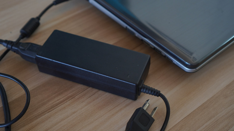Why Do Laptop Chargers Have A Box In The Middle Of The Cable?